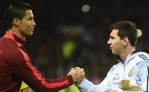 Cristiano Ronaldo and Messi greet each other before a friendly between Portugal and Argentina in 2014.