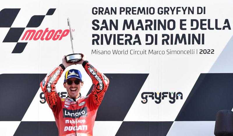 Bagnaia lifts the trophy for the winner of the San Marino Grand Prix.